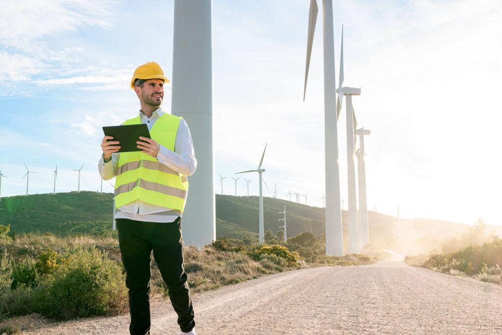employee-checks-wind-turbine-tablet